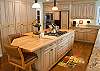Beautiful, gourmet kitchen with a gas range, dacor oven and warming drawer, wine cooler and large pantry.