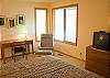 Additional view of this Queen Master Bedroom with nice natural lighting.