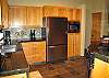 You will have plenty of room for everything in this oversized refrigerator.  There is a large pull out bottom freezer with an ice maker.