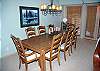 A charming wood dining room set with ample seating create the perfect backdrop for special meals and moments in Sunriver.