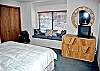 Upstairs bedroom features a king size bed and full bathroom.