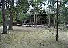 View from the back of the home. Has a back deck and a private/ secluded hot tub. Lots of room for the kids to play outside.