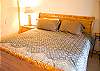 This is one of three downstairs king bedrooms. This one shares an attached bath with one other king bedroom.
