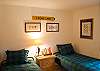 The second bedroom has two twin size beds.  This room is complete with books and toys.  The kids will love it!  The hall bath is right next door.
