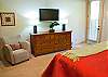 Large Master King Bedroom downstairs with private door to hot tub as well as a flat screen TV.