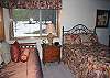 Downstairs Queen and twin trundle bed room with walk through bath to bunk bed room.