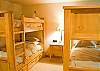Kid's Room Downstairs with a Flat Screen TV and 4 Twin Bunk Beds