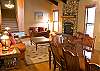 Escape from the winter weather to this cozy living room and dining area.  This room features a gas fireplace and comfortable furnishings.