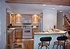View of the kitchen, and the bar. Very well stocked  kitchen waiting for you to cook a master peice.