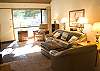 Recently up dated and furnished living room has slate entry, leather couches and chairs, beautiful rock fire place and beautiful view of the Meadows Golf Course.