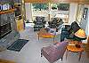 Great room.  Deck with great view.  Living room is spacious and light and bright!
