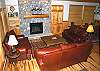 Living room with a gas fireplace beautifully decorated.