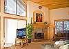 Living room offers a flat screen t.v and gas fireplace.