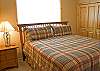 This King Master Bedroon has a shower with 2 sinks and a door to the deck.