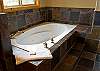 King Master Bathroom with a gorgeous jacuzzi tub.
