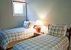 The loft features two Twin Beds with a bathroom at the top of the stairs.