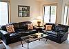 Comfy living room with views of golf course.