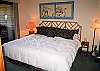 Ease your stress away in this downstairs king bedroom with the hot tub right outside your door!