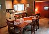 Great dining table with stools at kitchen bar.