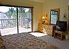 King Master Bedroom with a T.V. and access to the deck!