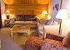 In the upstairs of the separate unit is this cozy living room, kitchenette and King bed.