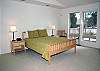 Upstairs Queen Master Suite.  This  bedroom is fresh and bright with modern furniture and stylish bedding.