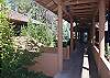 Covered walkway from house to apartment and garage.