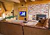 Imagine yourself enjoying your favorite game on TV lounging on this couch in this upstairs living room.