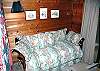This home has two other bedrooms. This bedroom features a twin bed with a trundle. A second guest bedroom features a queen size bed.