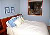 Enjoy your night's sleep in this queen bed.  This bedroom is off the living room and shares a hall bath.
