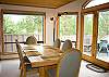 The open floor plan allows conversation from the kitchen to the dining room.