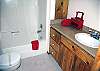 Downstairs bathroom located off of the living room.