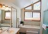 Master King Bathroom Upstairs. Jacuzzi tub and a walk in shower.