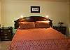 Private Master King Bedroom downstairs, TV, DVD/VHS and bath has tub/shower and door to the outside.