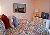 The King Master Bedroom has a sliding door which opens onto deck with great views of Lake Aspen and Mt. Bachelor.