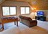 Flat screen t.v. and couch with Sleeper Sofa in the loft.