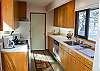 Another view of the galley style kitchen with lots of counter space.