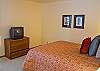 Additional view of this Queen Master Bedroom with nice natural lighting and TV.