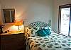 Comfortably decorated downstairs Queen Bedroom.