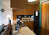 The kitchen over looks the dining/living area.