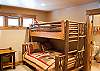 Bunk room downstairs has two pyramid bunks with double beds on the bottom and twins on the top. Also has it's own bathroom!