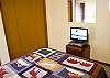 Downstairs Queen Bedroom with flat screen TV.