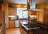 Gourmet kitchen with a six burner gas stove.