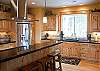 Amazing kitchen with top of the line appliances and a gas range.