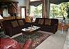 Living Room Area- Gather the family for a toasty fire and a movie in this plush living room.
