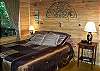Queen size bedroom with back porch views