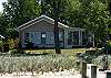 Darling in town cottage with private sandy beach and dock