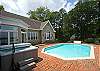 Close in home with pool, dock, hot tub and spacious light filled kitchen.