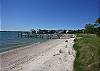 Darling in town cottage with private sandy beach and dock