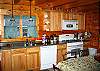 A well equipped, well built kitchen is a key part to any vacation rental home's formula for success.  Camp Narnia's done it right!  Features a Gas cook-top too.